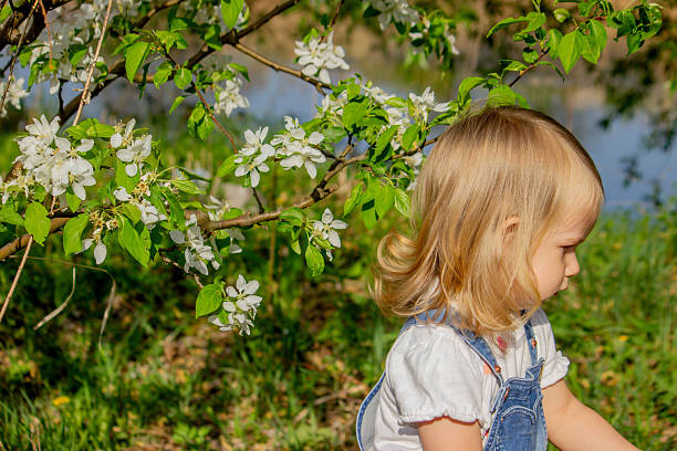 a little girl who is allergic to tree blossoms.