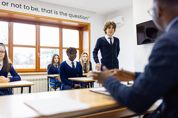 istock Classroom Discussion with Teacher and Students 2213942259