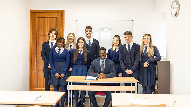 Group of Happy Students and Teacher in a Classroom