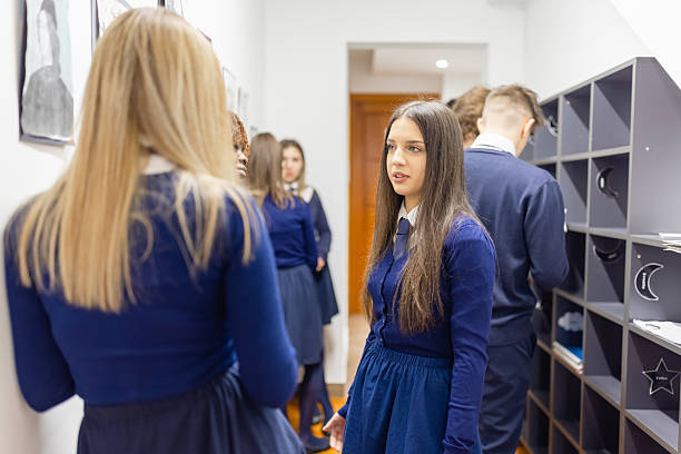 istock High School Students Socializing in Hallway 2213942295