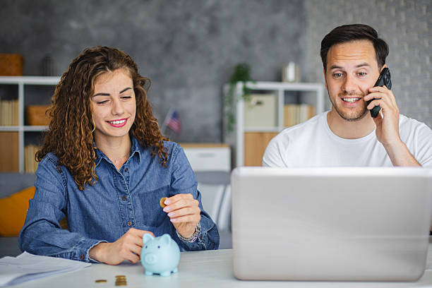 istock Young couple planning their home budget, talking with financial advisor 2213943320