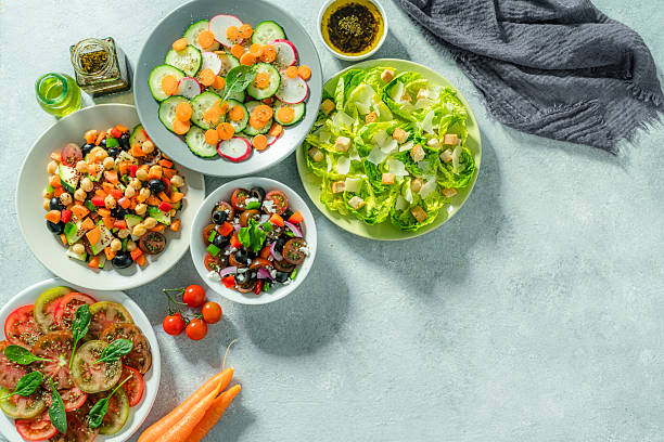 istock Healthy food: various salad plates shot from above. Copy space 2213943400