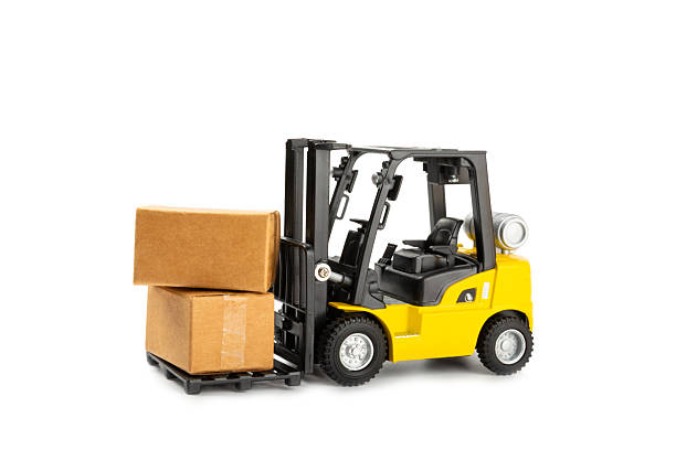 istock Yellow forklift isolated on white background. Logistics concept. Logistics and supply chain management for online shopping concept. Delivery of goods or products to the store worldwide. Cardboard box. 2213943534