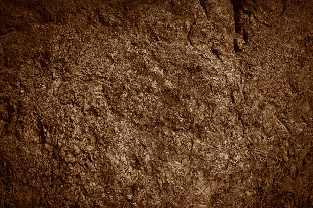 istock Brown rocky surface texture. Brown natural stone mountain background. 2213945036