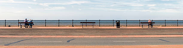 Bench in the coastal area near the sea for tourists to relax. Sea breeze, space for text