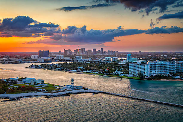The skyline of beautiful downtown Fort Lauderdale, Florida shot via helicopter from an altitude of about 600 feet over the Atlantic Ocean at sunset.