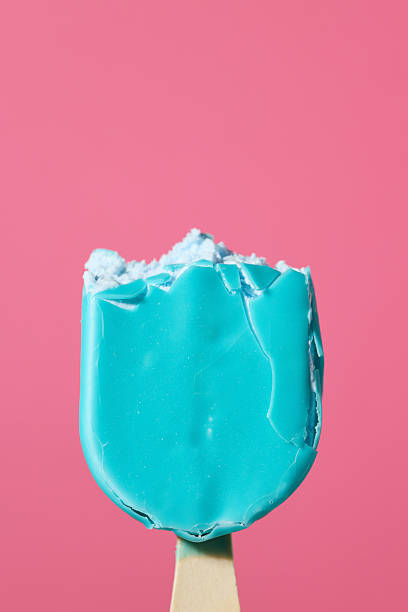 istock blue ice cream bar on wooden stick 2213951222