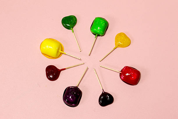 istock Colorful Lollipops isolated on a pink background. 2213953792