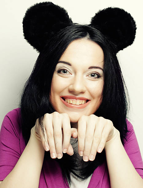 Surprised funny young woman with mouse ears