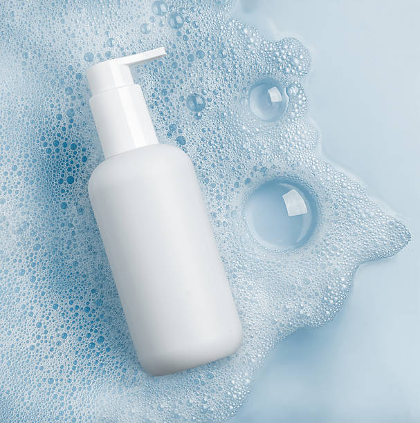 istock A Stylish and Minimalist White Cosmetic Bottle Featuring Foam and Bubbles for Elegance 2213957178