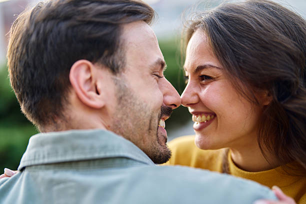 istock Happy couple rubbing noses and smiling 2213958890