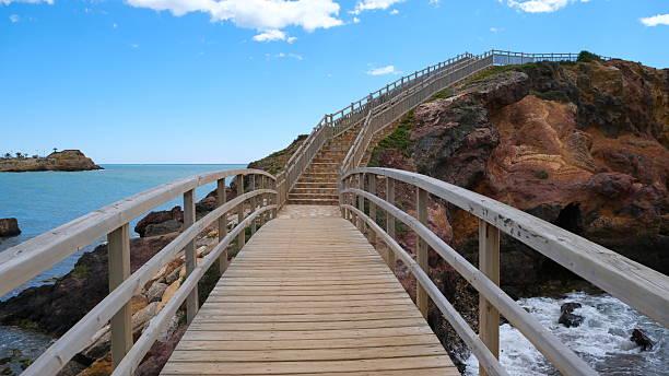 istock Stone staircase with wooden railing 2213964548