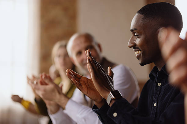 istock Diverse business team clapping hands during a meeting 2213968617