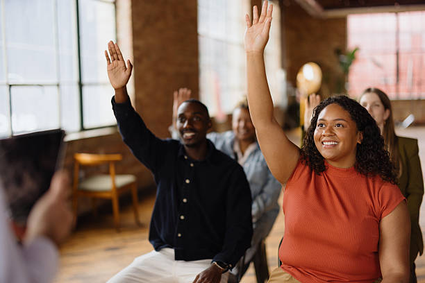 istock Students raising hands during a lesson in the classroom 2213968644