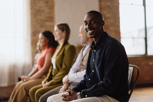 istock Young businessman smiling during a meeting with colleagues 2213968646