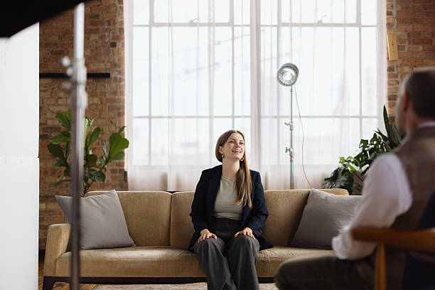 istock Young woman laughing during an interview in a loft 2213970413