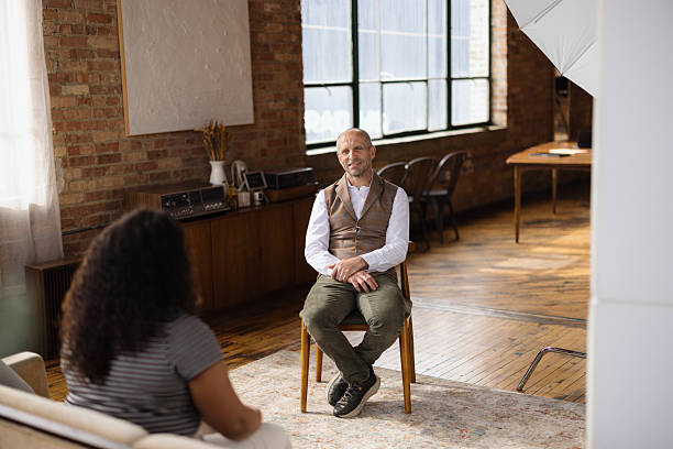 istock Mature man talking with a therapist in a loft 2213970453