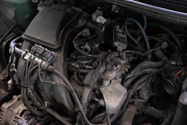 istock Car mechanic drain the old lubricant engine oil 2213970712