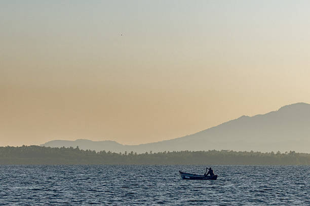 istock FISHING BOAT AT DAWN 2213971040