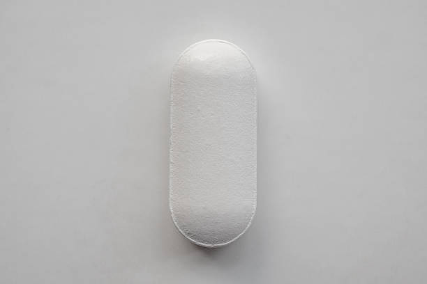 istock White medicine pill tablet on white background 2213972479