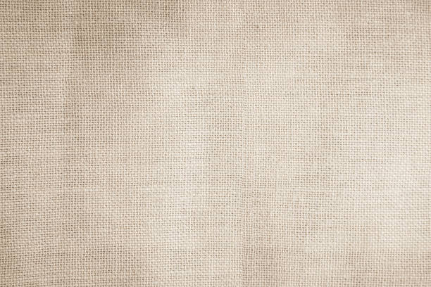 istock Brown sackcloth woven texture background in natural pattern. Jute hessian burlap, linen background in light beige cream color blank. Weaving canvas fiber line cotton cloth textured as organic. 2213972544