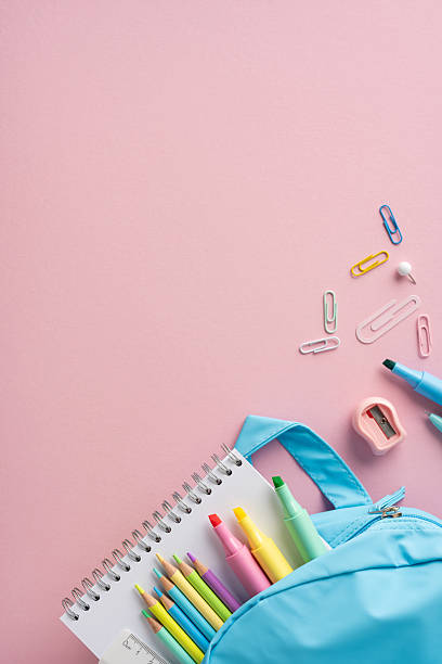 istock Pastel-colored vertical school accessories with a blue pencil bag and a notebook composition 2213974311