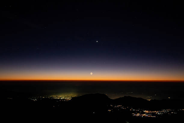 istock Crescent moon rising over sierra negra volcano at dawn 2213975651