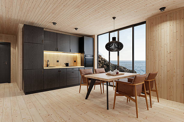 istock Compact Black Kitchen and Dining Area in Scandinavian Log Cabin with Sea View 2213976054