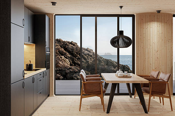 istock Compact Black Kitchen and Dining Area in Scandinavian Log Cabin with Sea View 2213976358