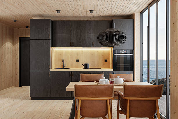 istock Compact Black Kitchen and Dining Area in Scandinavian Log Cabin with Sea View 2213976385