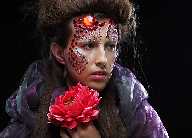 istock woman in creative image with big flowers. 2213976487