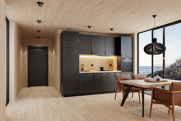 istock Compact Black Kitchen and Dining Area in Scandinavian Log Cabin with Sea View 2213976935