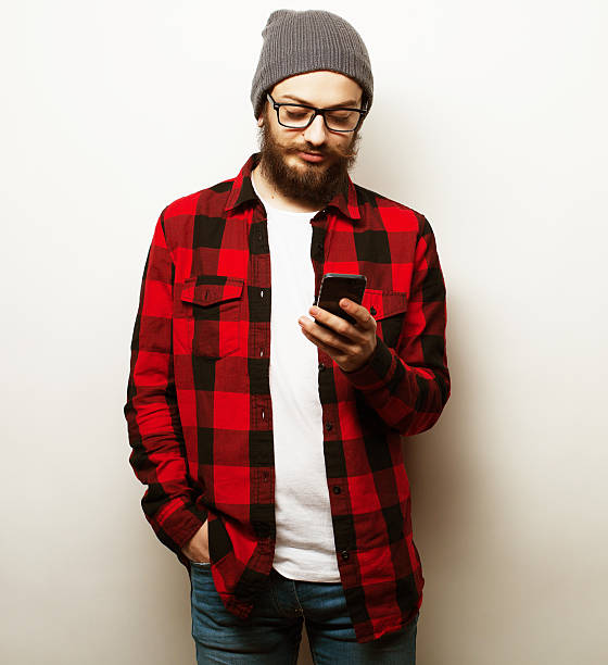 istock young bearded man with mobile phone 2213977610