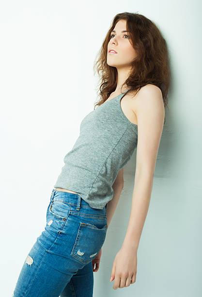 istock Young beautiful curly woman posing ower white background 2213980752