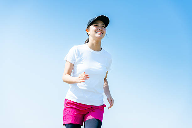istock young woman running 2213981173