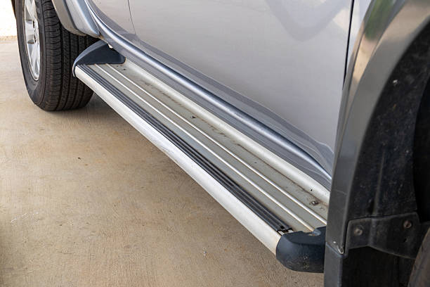 istock Vehicle side steps installation in a garage automotive maintenance close-up view practical guide 2213990078