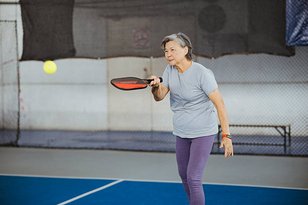 istock Senior Woman Staying Active Through Pickleball 2213990590