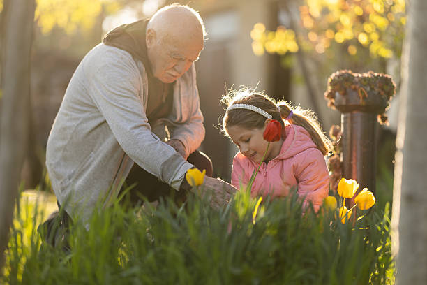 istock Enjoying sunny spring day in their beautiful garden 2213992623