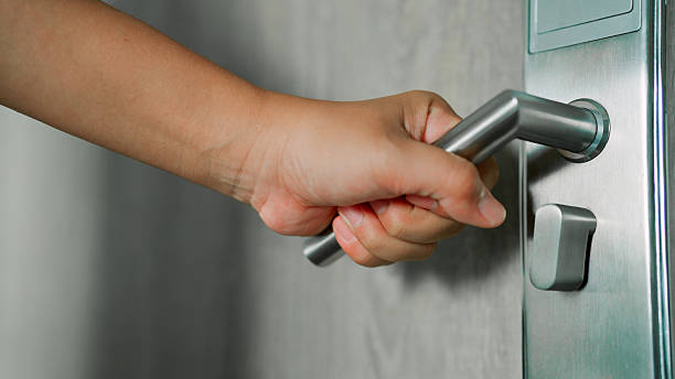 istock Asian woman open the door 2213997109