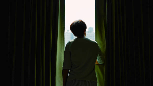 Asian woman feeling serious and pressure in bedroom