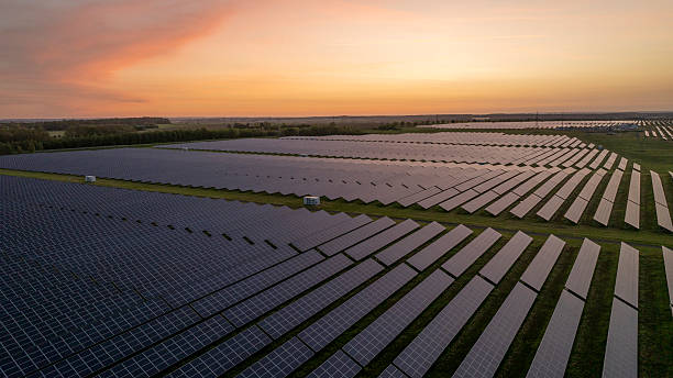 istock Solar Panels Field at Sunset Generating Clean Energy 2213999006