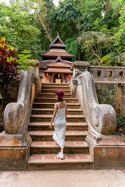 istock Young Woman Exploring Wat Pha Lat in Chiang Mai 2213999297