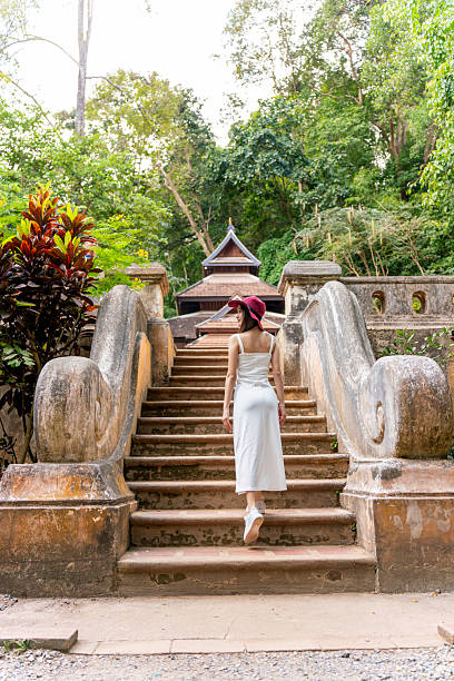 istock Young Woman Exploring Wat Pha Lat in Chiang Mai 2213999335
