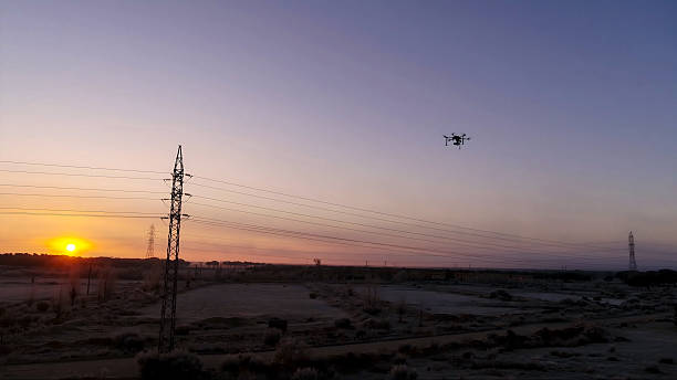 istock Inspection process of high-voltage towers with drones for maintenance 2214001882