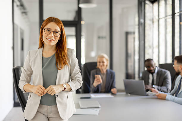 istock Confident woman poses confidently in an office setting 2214002578