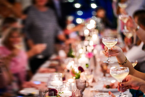 istock A festive celebration with champagne glasses raised in joyful toast 2214003375