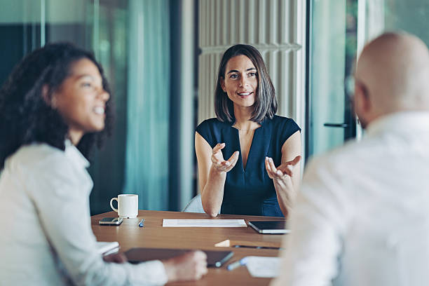 istock Focus on a female entrepreneur talking during a meeting 2214003620