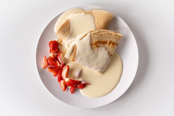Sweet Rolled Pancakes roll with berry and cream.
