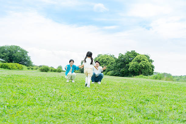 family playing in the park