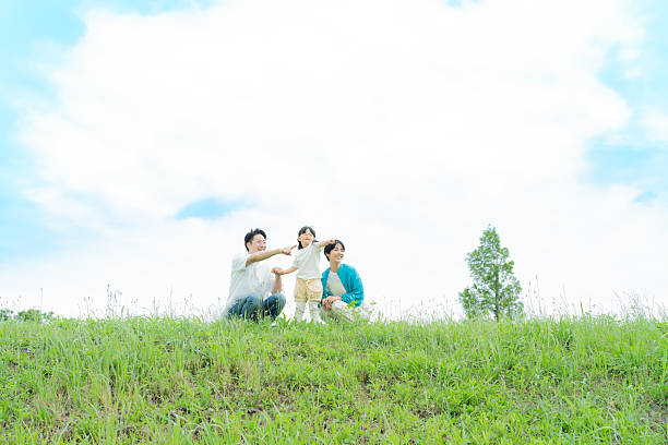 family playing in the park